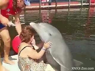 Sexy Cuban granny gets dry humped by a dolphin